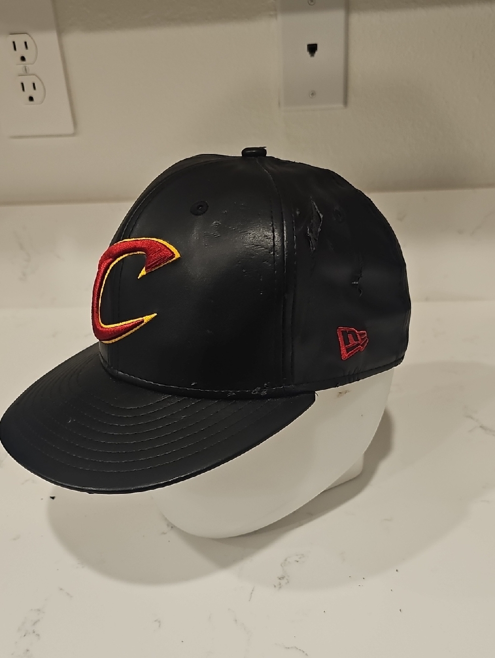 New Era Black Faux Leather Snapback Hat with Red & Gold 'C' Logo